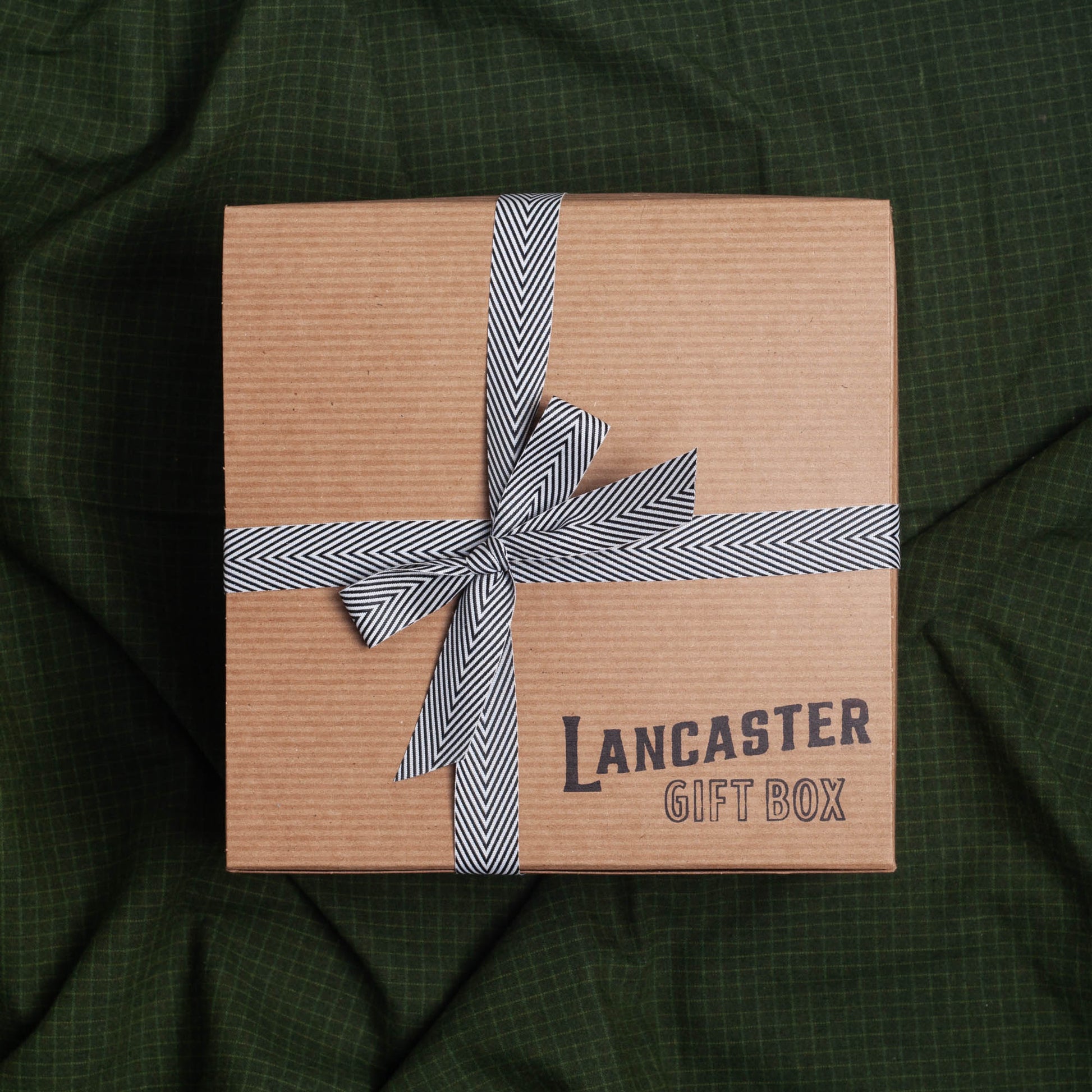 Lancaster Gift Box tied with a black and white bow.